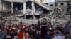 Palestinians hold Eid al-Adha prayers by the ruins of the Al-Rahma mosque destroyed by Israeli airstrikes, amid the Israel-Hamas conflict, in Khan Younis, in the southern Gaza Strip, June 16, 2024. 