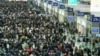 Passengers gather at the Shanghai Hongqiao railway station in Shanghai on Feb. 3, 2024, during peak travel ahead of the Lunar New Year of the Dragon, which falls on February 10.
