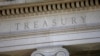 FILE- The U.S. Treasury Department building is shown at dusk in Washington.