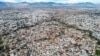 FILE - This picture taken on December 8, 2023 shows an aerial view of the divided walled city of Cyprus' capital Nicosia and the city center in the area controlled by the Republic of Cyprus in the foreground.