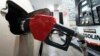 FILE - A car is fueled at a Costco Warehouse gas station in Cranberry, Pennsylvania, Jan. 23, 2023.