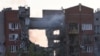 A firefighter works at a site of an apartment building hit by a Russian missile strike in the city of Dnipro, Ukraine, June 28, 2024.