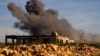 Black smoke rises from an Israeli airstrike on the outskirts of Yaroun, a Lebanese border village with Israel, in southern Lebanon, Dec. 10, 2023.