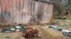 FILE — Bodies are strewn near houses in the West Darfur capital El Geneina, June 16, 2023. Up to 15,000 people were killed in the city last year in ethnic violence, according to a United Nations report seen by Reuters on Friday. 