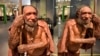 FILE - A reconstructed representation of a Homo neanderthalensis is reflected in a mirror at the Neanderthal Museum in Mettmann, Germany, located at the site of the first Neanderthal man discovery, July 3, 2019.