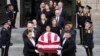 The flag-draped casket of retired Supreme Court Justice Sandra Day O'Connor departs the National Cathedral in Washington, following a memorial service, Dec. 19, 2023. 