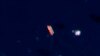 FILE - In this satellite photo provided by Planet Labs PBC, vessels identified as the Virgo, left, and the Suez Rajan — now the St. Nikolas — by the advocacy group United Against Nuclear Iran are seen in the South China Sea on Feb. 13, 2022. 