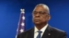 FILE - US Secretary of Defense Lloyd Austin looks on during a joint press conference with Israeli Defense Minister Yoav Gallant at Israel's Ministry of Defense in Tel Aviv, Israel, Dec. 18, 2023.