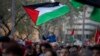 FILE - A child waves a Palestinian flag during a call for a cease-fire in Gaza, in Barcelona, Spain, Jan. 20, 2024. Spain is one of the countries that have officially recognized a Palestinian state. Armenia said Friday it also is recognizing a Palestinian state.