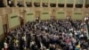 FILE - Poland's lawmakers vote in parliament, in Warsaw, May 26, 2023. 