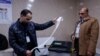 Officials work after the close of the polling station during Iraq's provincial council elections, in Mosul, Iraq Dec. 18, 2023.