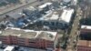 In this photo released by Xinhua News Agency, an aerial drone shows the dormitory with charred windows after a fire at the Yingcai School in Dushu Town, Fangcheng County, Nanyang city, in central China's Henan province on Jan. 20, 2024. 