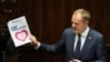 Newly appointed Polish Prime Minister Donald Tusk presents his government's programme and asks for a vote of confidence in Parliament in Warsaw, Dec. 12, 2023. 