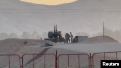 Military personnel stand guard at a nuclear facility in the Zardanjan area of Isfahan, Iran, April 19, 2024, in this screen grab taken from video. (West Asia News Agency via Reuters) 