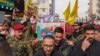Honor guards carry the coffin of Razi Moussavi during his funeral procession at the Imam Ali shrine in Iraq's holy city of Najaf, on Dec. 27, 2023.