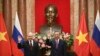 Russian President Vladimir Putin, left, and Vietnam's President To Lam pose for photos at the Presidential Palace in Hanoi, Vietnam, June 20, 2024. 