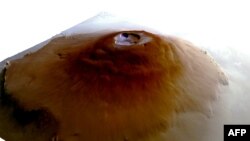 This handout photo obtained June 10, 2024, shows a 3D model of the Olympus Mons volcano on Mars, as observed from a Mars Express spacecraft. Scientists have spotted water frost near Mars' equator for the first time. (European Space Agency)