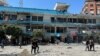 Palestinians inspect the site of an Israeli strike on a UNRWA school sheltering displaced people, amid the Israel-Hamas conflict, in Nuseirat refugee camp in the central Gaza Strip, June 6, 2024. 