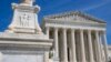 FILE - The US Supreme Court is seen, with a carving of Justice in the foreground, April 19, 2023, in Washington.