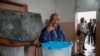 Incumbent Comoros President and presidential candidate for the Convention for the Renewal of the Comoros (CRC) party, Azali Assoumani, gestures after casting his ballot at the Mitsudje public school polling station in Moroni, Jan. 14, 2024. 