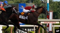 Dornoch, (6), ridden by Luis Saez, crosses the finish line ahead of Mindframe (10), ridden by Irad Ortiz Jr., to win the 156th running of the Belmont Stakes horse race, June 8, 2024, in Saratoga Springs, NY. 