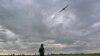 An operator controls a reusable airstrike drone called Punisher made by the Ukrainian company UA Dynamics during a test in Kyiv region on Aug. 11, 2023, amid Russian invasion in Ukraine.