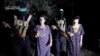Yocheved Lifshitz and Nurit Cooper, who were held hostage by Palestinian Hamas militants, are released by the militants, in this video screengrab obtained by Reuters on Oct. 23, 2023. (Al-Qassam Brigades, military wing of Hamas)