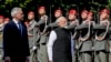 Indian Prime Minister Narendra Modi, right, is welcomed with military honors by Austria's Chancellor Karl Nehammer in Vienna, July 10, 2024.