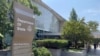 FILE — Signage is seen outside one of the entrances of the U.S. Department of State in Washington, Aug. 6, 2021. 