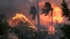 FILE - The hall of historic Waiola Church in Lahaina and nearby Lahaina Hongwanji Mission are engulfed in flames along Wainee Street on Aug. 8, 2023, in Lahaina, Hawaii.