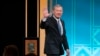 FILE - U.S. Supreme Court Chief Justice John Roberts waves after receiving the Henry J. Friendly Medal during the American Law Institute's annual dinner in Washington, May 23, 2023.