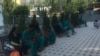 FILE - A group of medical students from India resting on a bench at the campus of Osh State University's medical facility, photo taken on May 24, 2024, Osh, Kyrgyzstan.
