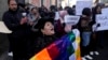 Alicia Chura, a supporter of Bolivian President Luis Arce, shouts against a now-ousted Bolivian army chief who led some soldiers to storm the presidential palace, outside police offices in La Paz, Bolivia, June 27, 2024.
