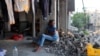 A displaced Palestinian girl sits in a damaged building used as a temporary shelter in al-Bureij refugee camp in the central Gaza Strip on June 12, 2024.