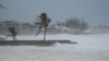 Waves batter a pier as Hurricane Beryl passes through Hastings, Barbados, July 1, 2024. Beryl later made landfall in Grenada.