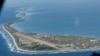 FILE - Funafuti, the main island of the nation state of Tuvalu, is photographed from a Royal New Zealand air force C130 aircraft as it approaches the tiny South Pacific nation. 