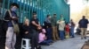 People queue near a polling station during the general election, in Mexico City, June 2, 2024. 