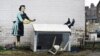 An artwork depicting violence against women, painted by street artist Banksy for the occasion of Valentines Day, is seen on a wall in Margate, Kent, Britain, Feb. 14, 2023 in this picture obtained from social media.