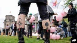 Demonstrators demand a law to protect the rights of transgender people outside of the parliament Bundestag building in Berlin, April 12, 2024.