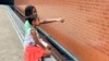 Gabriella Jackson, 7, and Erica Jackson, 9, look for familiar names on the National Monument to Freedom in Montgomery, Alabama, June 19, 2024. The monument is inscribed with 122,000 surnames that formerly enslaved people chose for themselves after being emancipated.