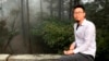 In this photo released by Free Huang Xueqin & Wang Jianbing, Chinese labor activist Wang Jianbing poses on Mount Lushan in Jiangxi province in April 2021.
