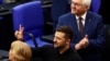 Ukrainian President Volodymyr Zelenskyy, middle, gestures following his address to the lower house of parliament Bundestag in Berlin, Germany, June 11, 2024.