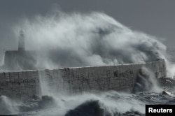 Large waves hit the harbour wall during Storm Isha in Newhaven, southern Britain, Jan. 22, 2024.