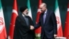 Turkey's President Tayyip Erdogan and Iran's President Ebrahim Raisi shake hands following a press conference in Ankara, Turkey, Jan. 24, 2024.