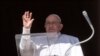 Pope Francis waves at the crowd, who are gathered on St Peter's Square during the Angelus prayer, from his window at the Vatican, Jan. 21, 2024. (Vatican Media/­Handout via Reuters)