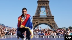 Gold medalist in the men's singles tennis event Serbia's Novak Djokovic poses at the Champions Park at Trocadero during the Paris 2024 Olympic Games in Paris on Aug. 5, 2024. 