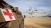 A military medical vehicle stands near the French ship amphibious helicopter carrier Dixmude, amid the ongoing conflict between Israel and the Palestinian Islamist group Hamas, in the city of Al-Arish, Sinai peninsula, Egypt, Jan. 21, 2024. 