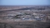 FILE — This Dec. 29, 2019, aerial photo shows Iraq's Ain al-Asad air base in the western Anbar desert. U.S. personnel suffered minor injuries and a member of Iraq's security forces was seriously wounded in an attack on the base Saturday, a U.S. official said. 