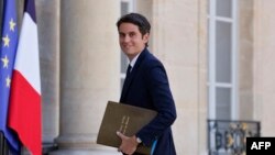 FILE - Then French Junior Minister for Public Accounts Gabriel Attal arrives at a Cabinet meeting held after a Cabinet reshuffle at The Elysee Presidential Palace in Paris on July 4, 2022.