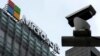 FILE - A security surveillance camera is seen near the Microsoft office building in Beijing, China, July 20, 2021.